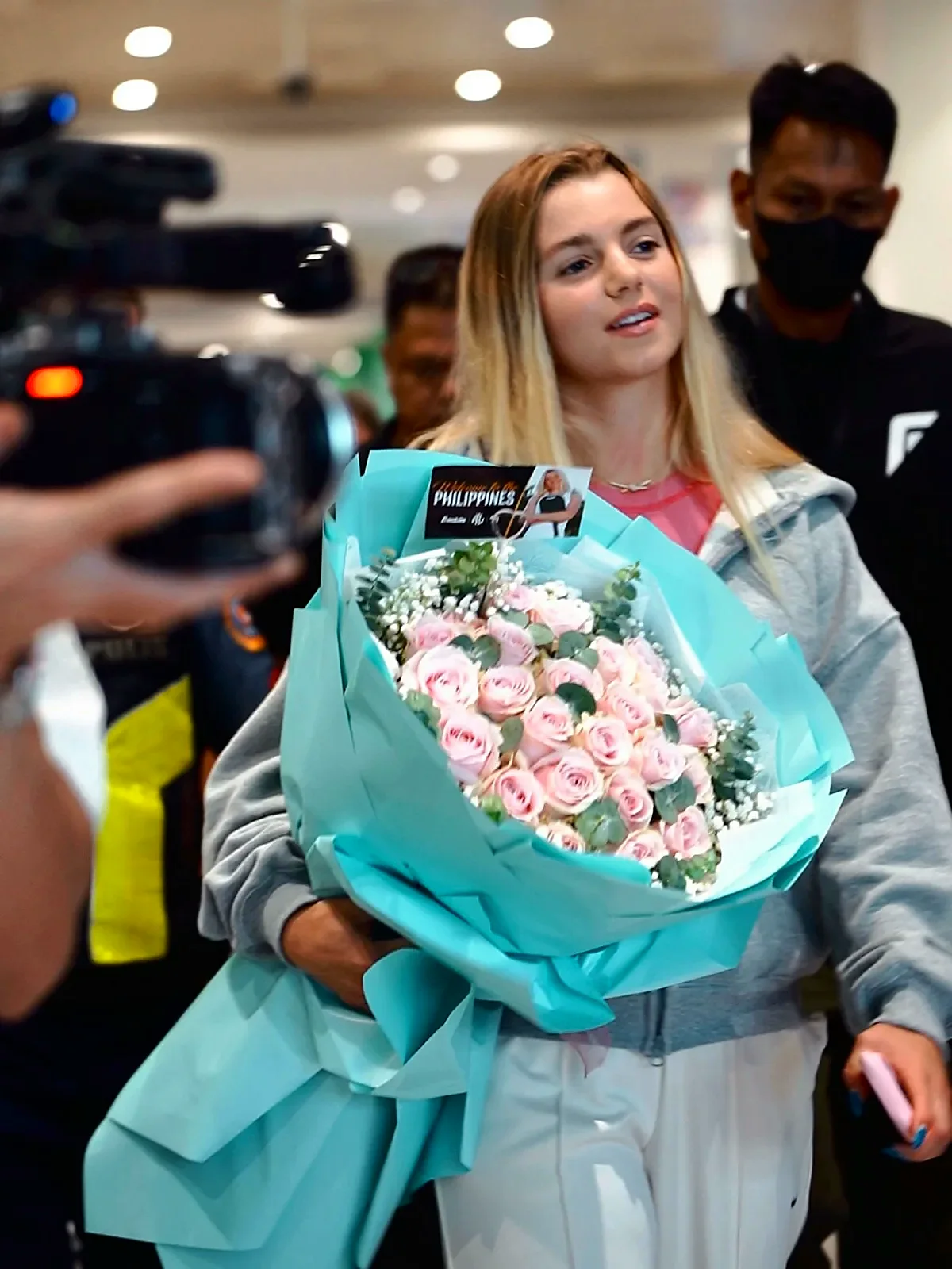 Cameras follow Anna Leigh Waters through NAIA arrivals