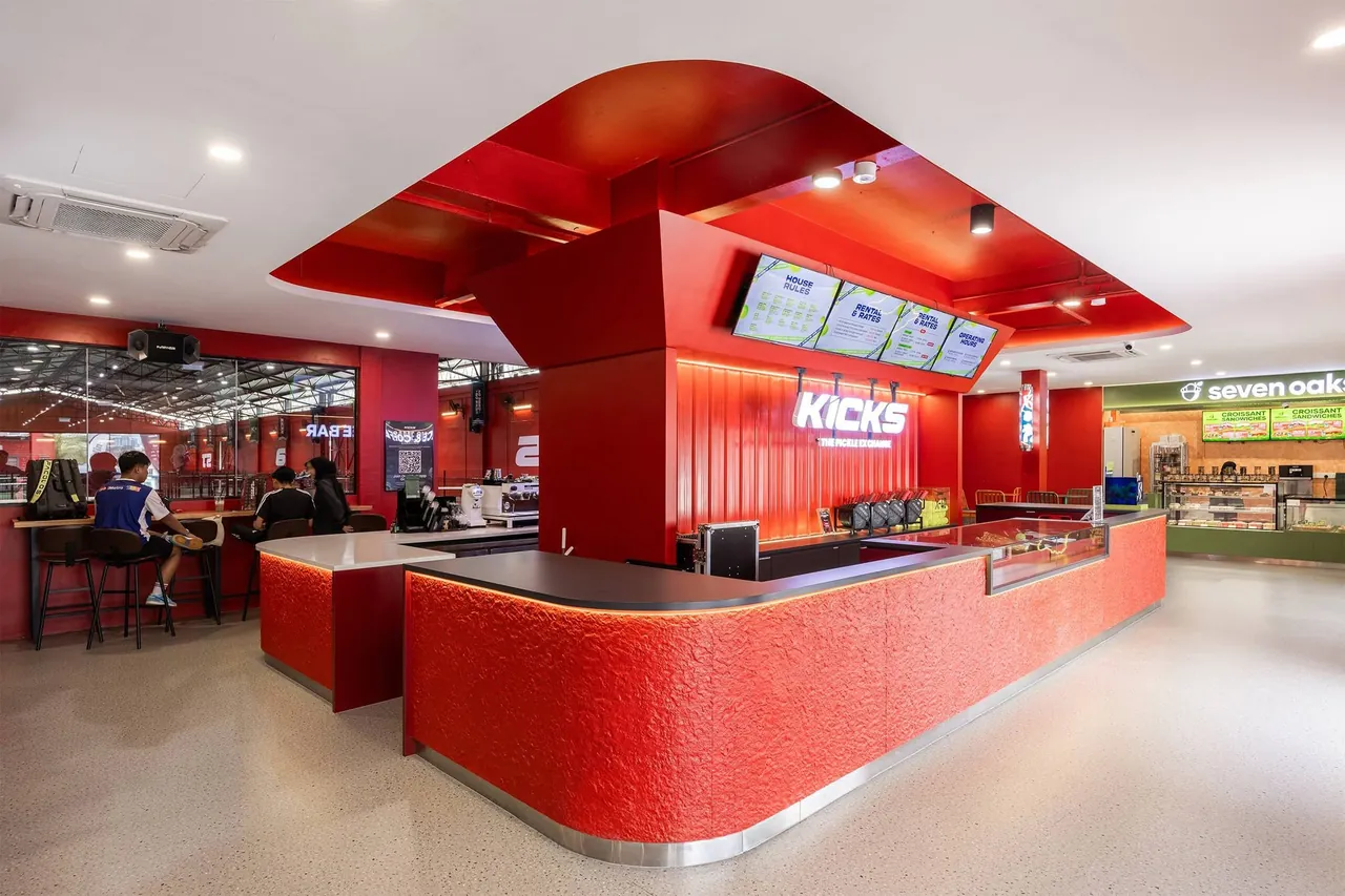 The cafe counter and window bar at Kicks, overlooking the courts