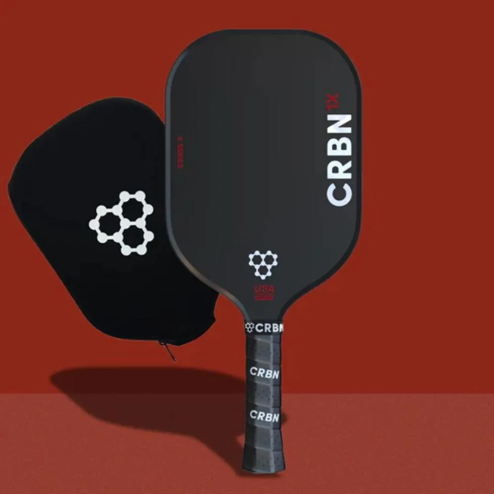 CRBN 1X Pickleball Paddle with included paddle cover shown on red background
