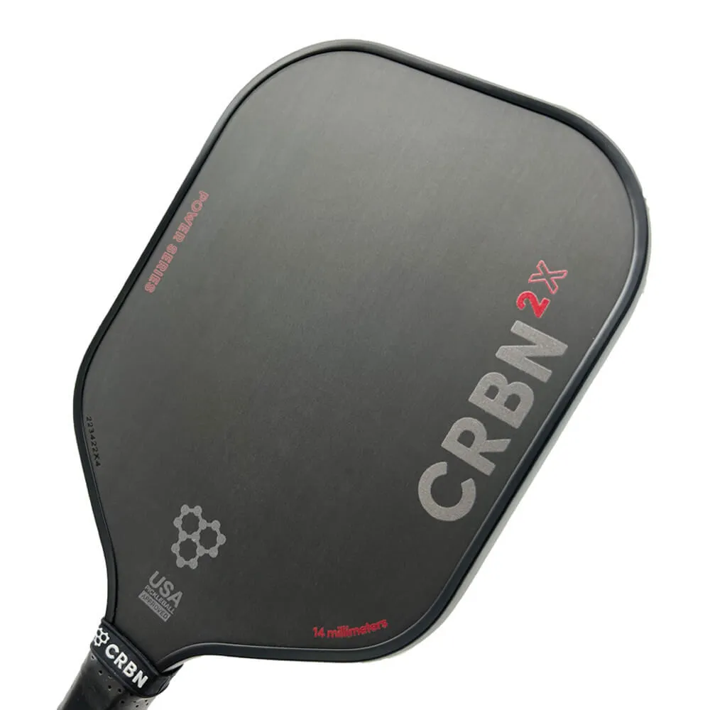 Close up view of the CRBN-2X Pickleball Paddle featuring a dark grey carbon face