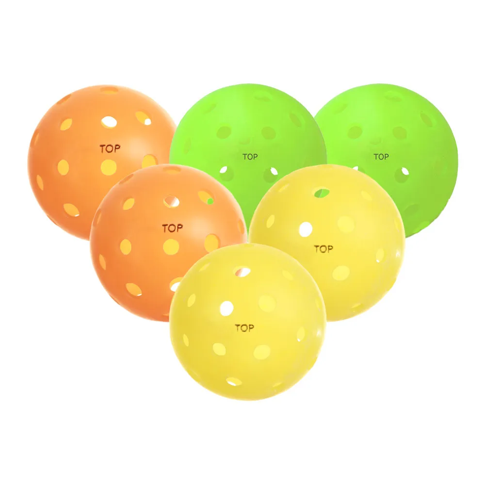 Six TOP balls. Two orange, two neon, two yellow.