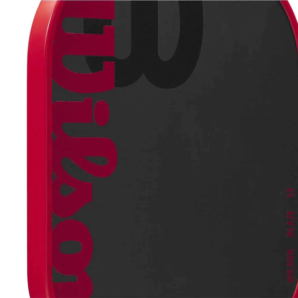 Close up view of the Wilson Blaze 13mm Carbon-Fiberglass Hybrid Pickleball Paddle's face and texture.