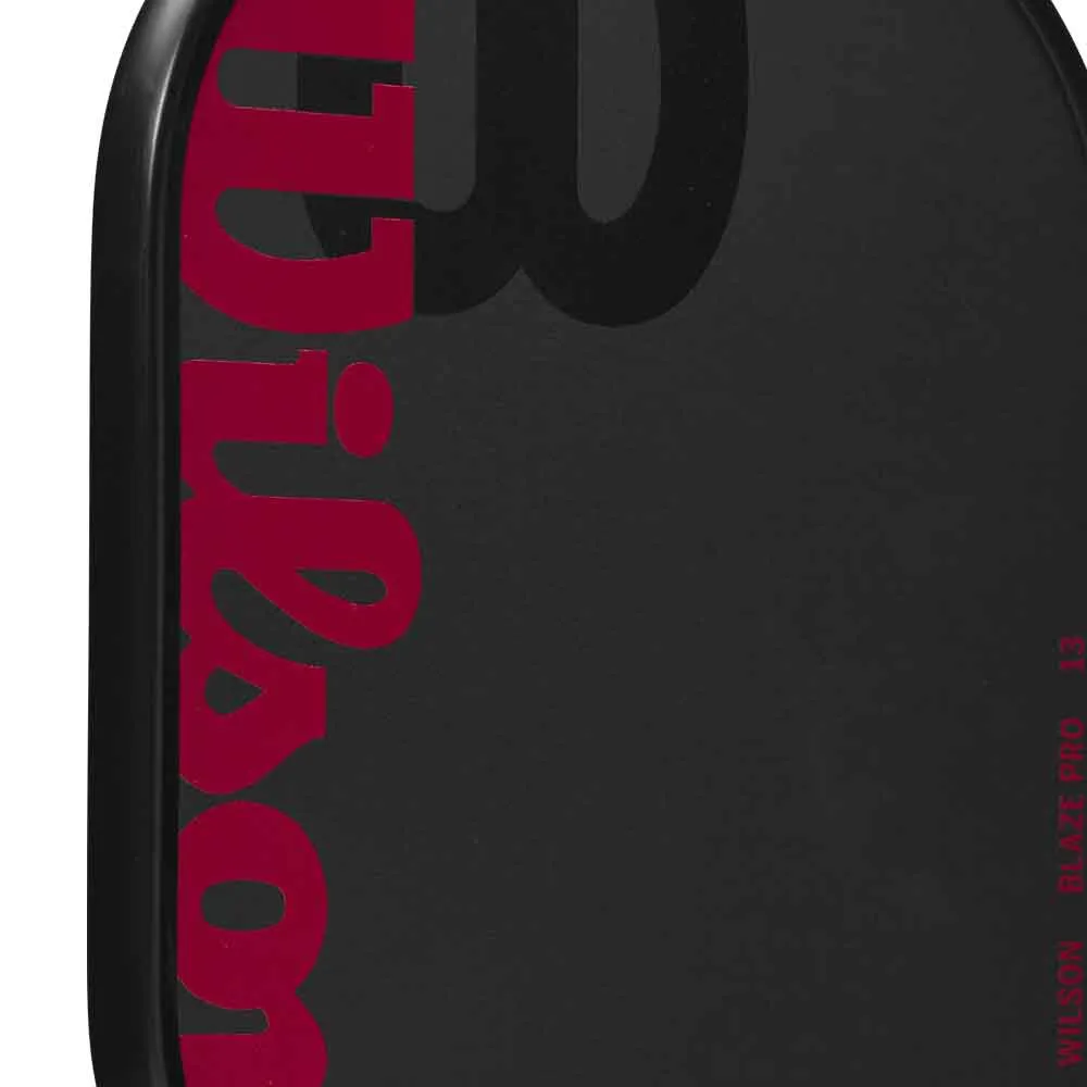Close-up view of the Wilson Blaze Pro 13mm Carbon Fiber Pickleball Paddle's face and texture.